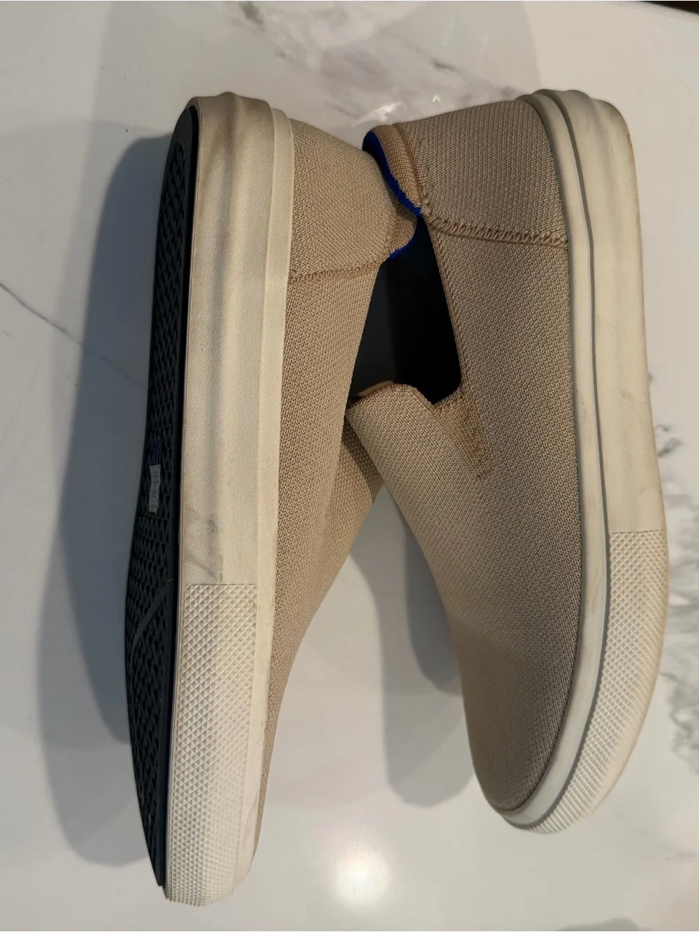 Rothy's Slip-On Flats in Tan with Blue Heel Accent